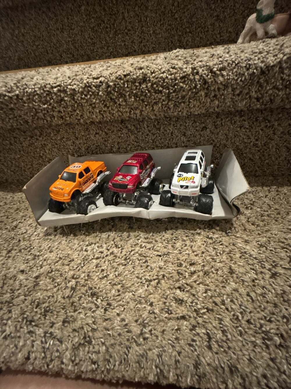 Lot of 3 Monster Trucks with Display Stand
